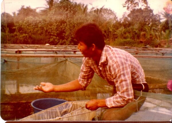 1975 Eldest Brother feeding guppies